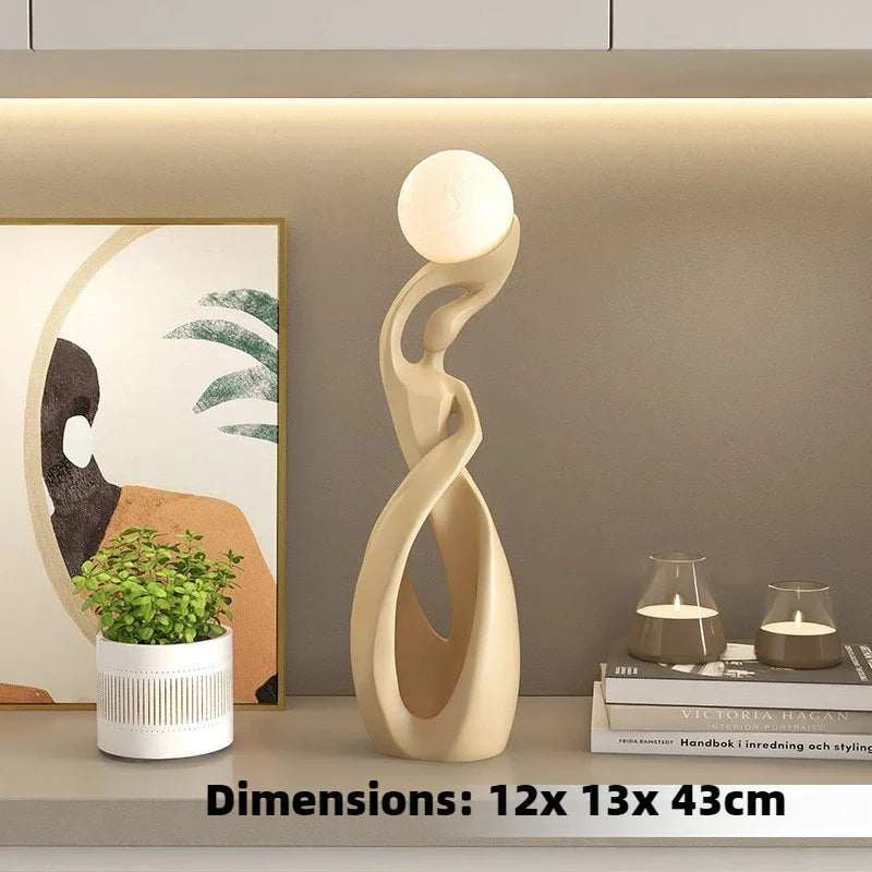 Home Decoration Resin Sculpture floor lamp in cream-colored resin, featuring an open twisted figure and glowing spherical top.