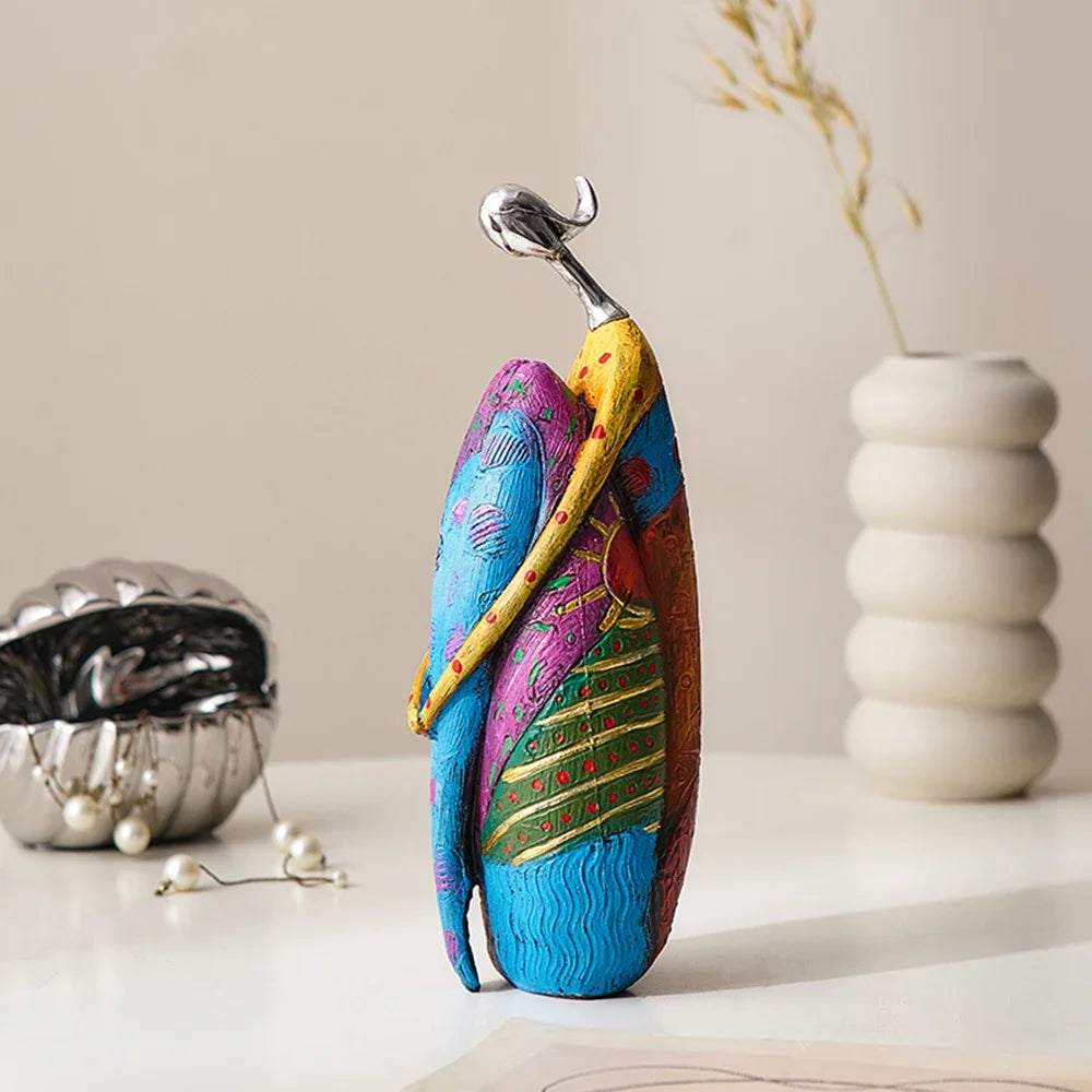 Nordic Style Abstract resin figurine with colorful blue, green, and purple patterned forms embracing beneath a silver accent