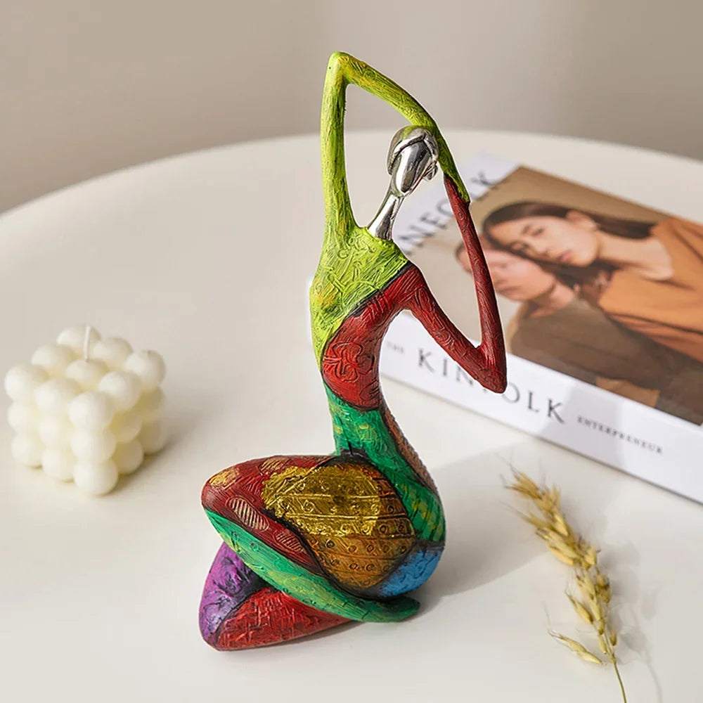 Nordic Style Abstract resin sculpture with a seated figure, vivid green, red, blue and purple geometric sections and glossy finish.