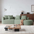 Chenille Sectional Sofa in sage green textured upholstery, with a curved chaise, deep seats and four matching pillows