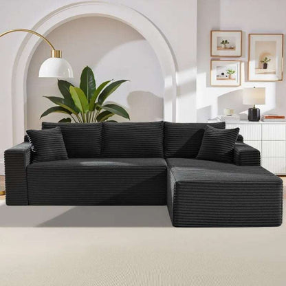 Corduroy L-Shaped Sectional in black ribbed upholstery, with a deep seat, matching cushions, and chaise extension
