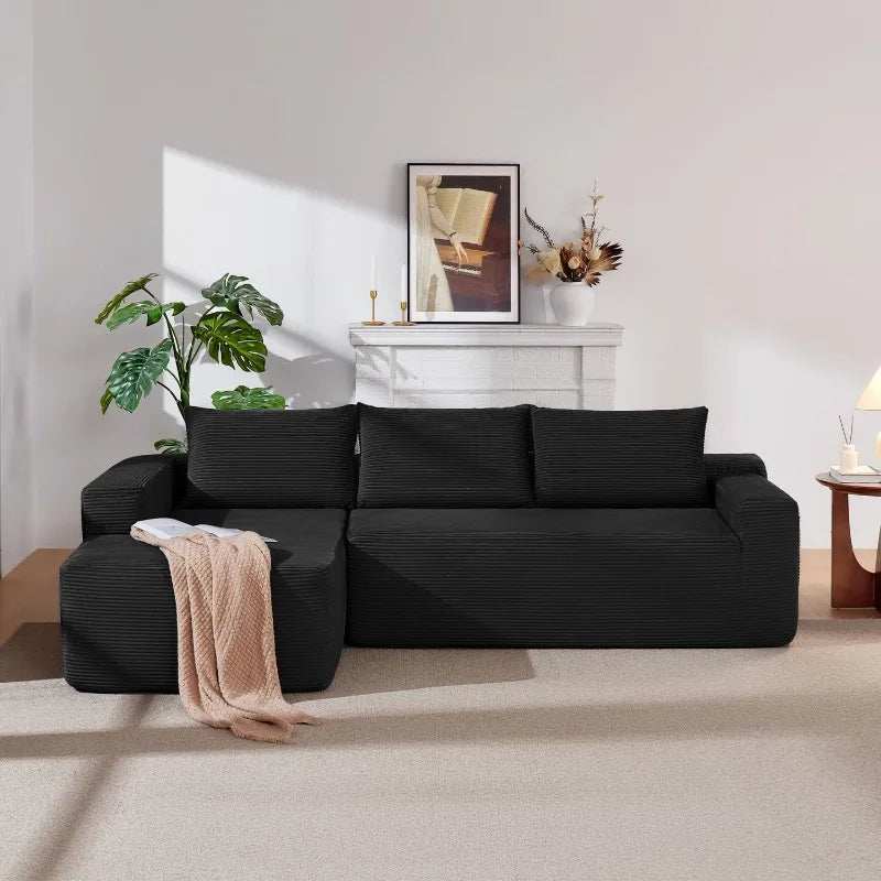 Corduroy L-Shaped Sectional in black ribbed upholstery, with a chaise lounge and deep, wide seat cushions