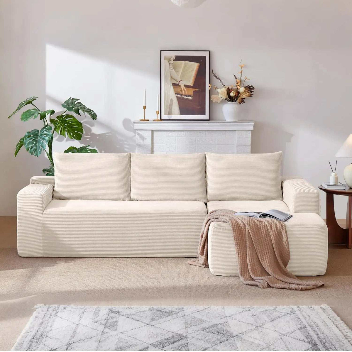 Corduroy L-Shaped Sectional in cream ribbed upholstery with a deep seat and chaise lounge