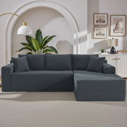 Corduroy L-Shaped Sectional in dark charcoal ribbed upholstery, with deep seats, bolster cushions and a broad chaise.