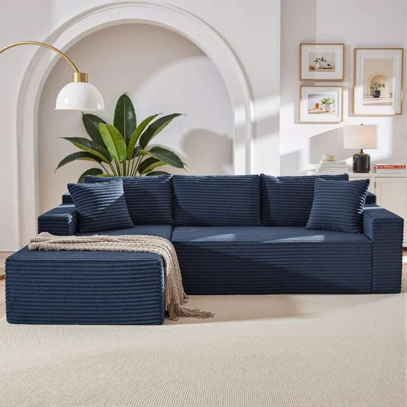 Corduroy L-Shaped Sectional in dark navy ribbed upholstery, with a deep seat, chaise lounge and matching cushions