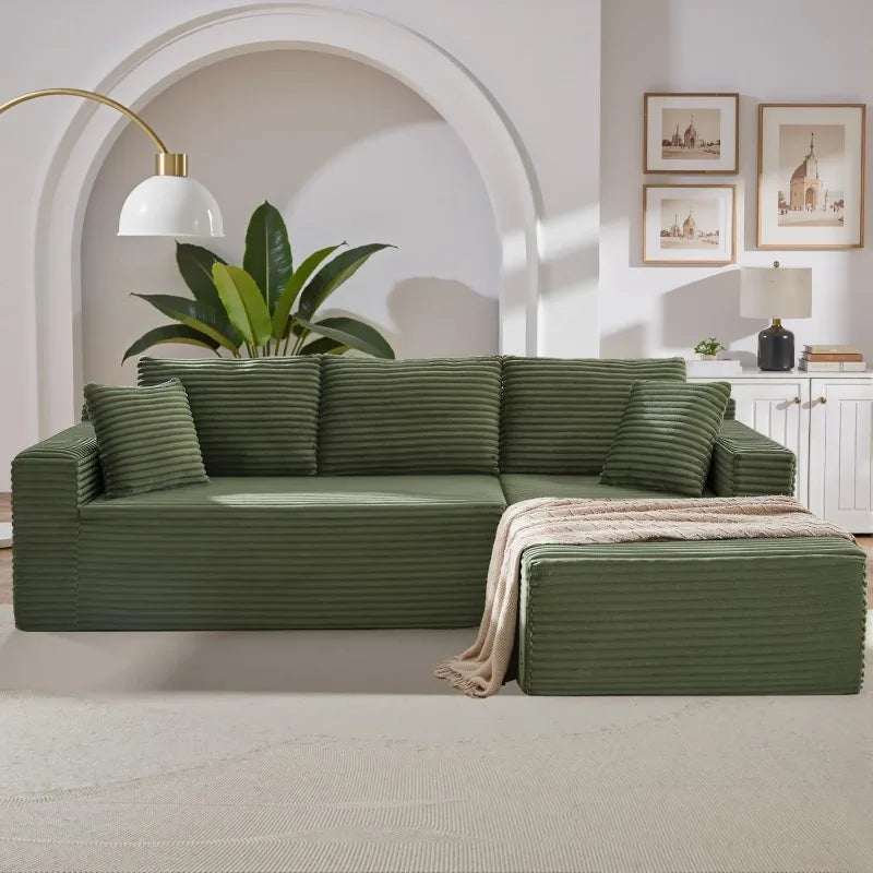 Corduroy L-Shaped Sectional in olive green ribbed upholstery, with a chaise extension and matching cushions.