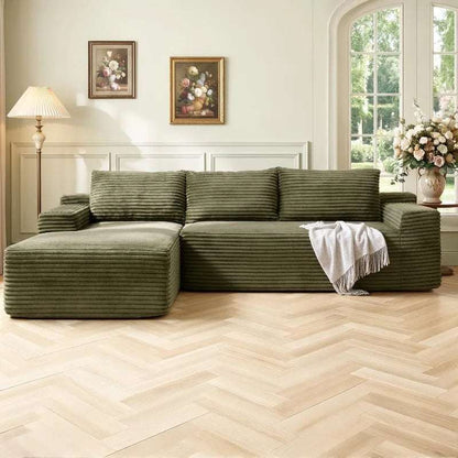 Corduroy L-Shaped Sectional in olive green ribbed upholstery, with deep seats, broad arms and a chaise-style extension.