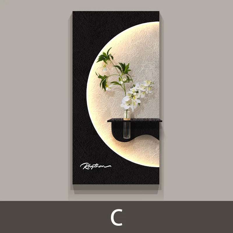 Green Plant LED Wall Lamp with black rectangular panel, glowing crescent, and green stems with white flowers above a shelf.