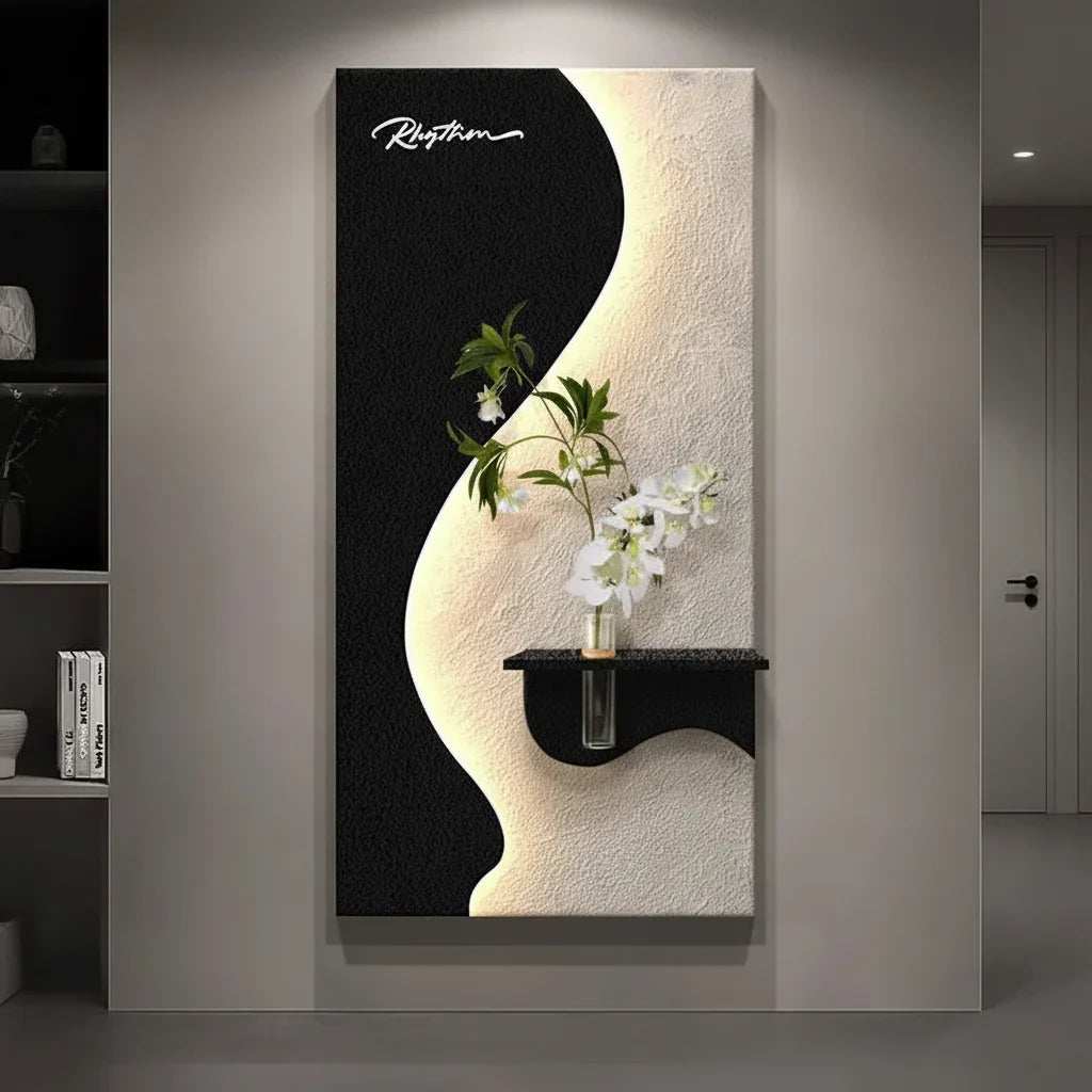Green Plant LED Wall Lamp with a black and white sculptural panel, warm backlighting, and a small floral shelf detail.