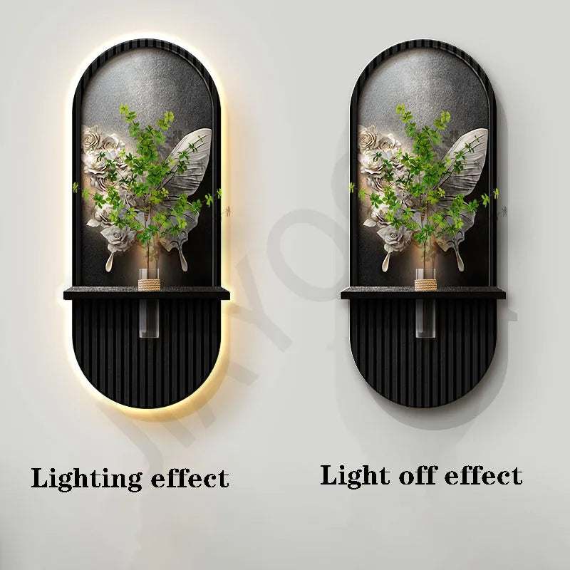 Green Plant Wall Lamp in a black oval metal frame with arched glass panel, greenery, and warm backlighting
