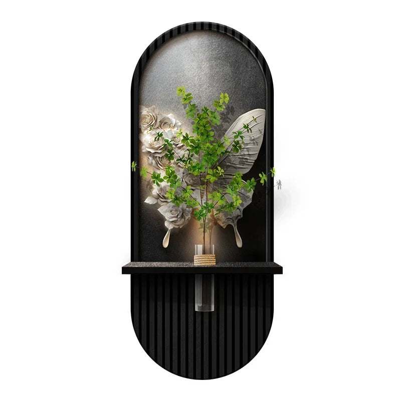 Green Plant Wall Lamp with a black ribbed frame, arched mirrored backing, and decorative green foliage with pale flowers