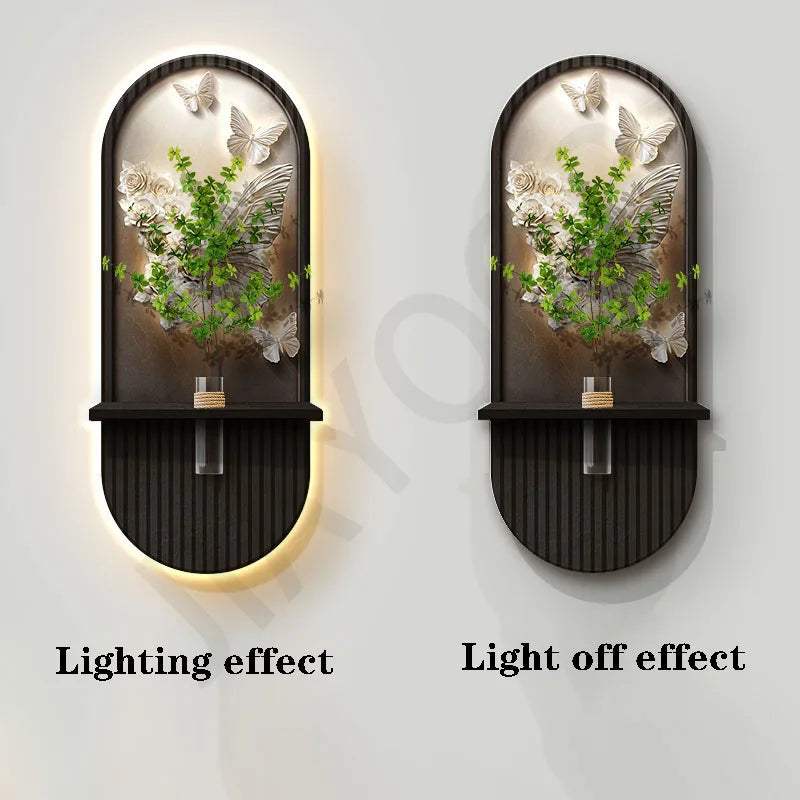Green Plant Wall Lamp with a black oval frame, glass panel, and raised green foliage with white flowers and butterflies