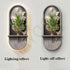 Green Plant Wall Lamp with a gray stone-look arched panel, raised green foliage, butterfly accents, and a slim shelf