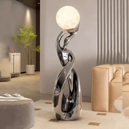 LED Floor Lamp Alloy Stand Light with a polished silver alloy stand, sculptural twisted design, and glowing spherical shade