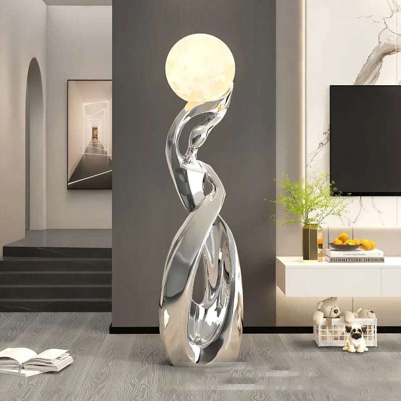LED Floor Lamp Alloy Stand Light with a sculptural silver metallic stand and glowing round globe shade.