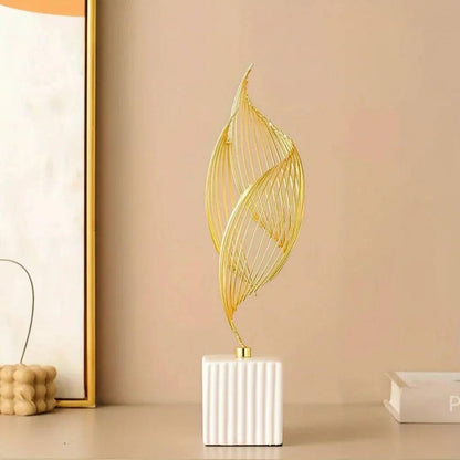 Nordic Ceramic Statue with a white ribbed ceramic base and slender gold metal wire sculpture in an abstract leaf shape.