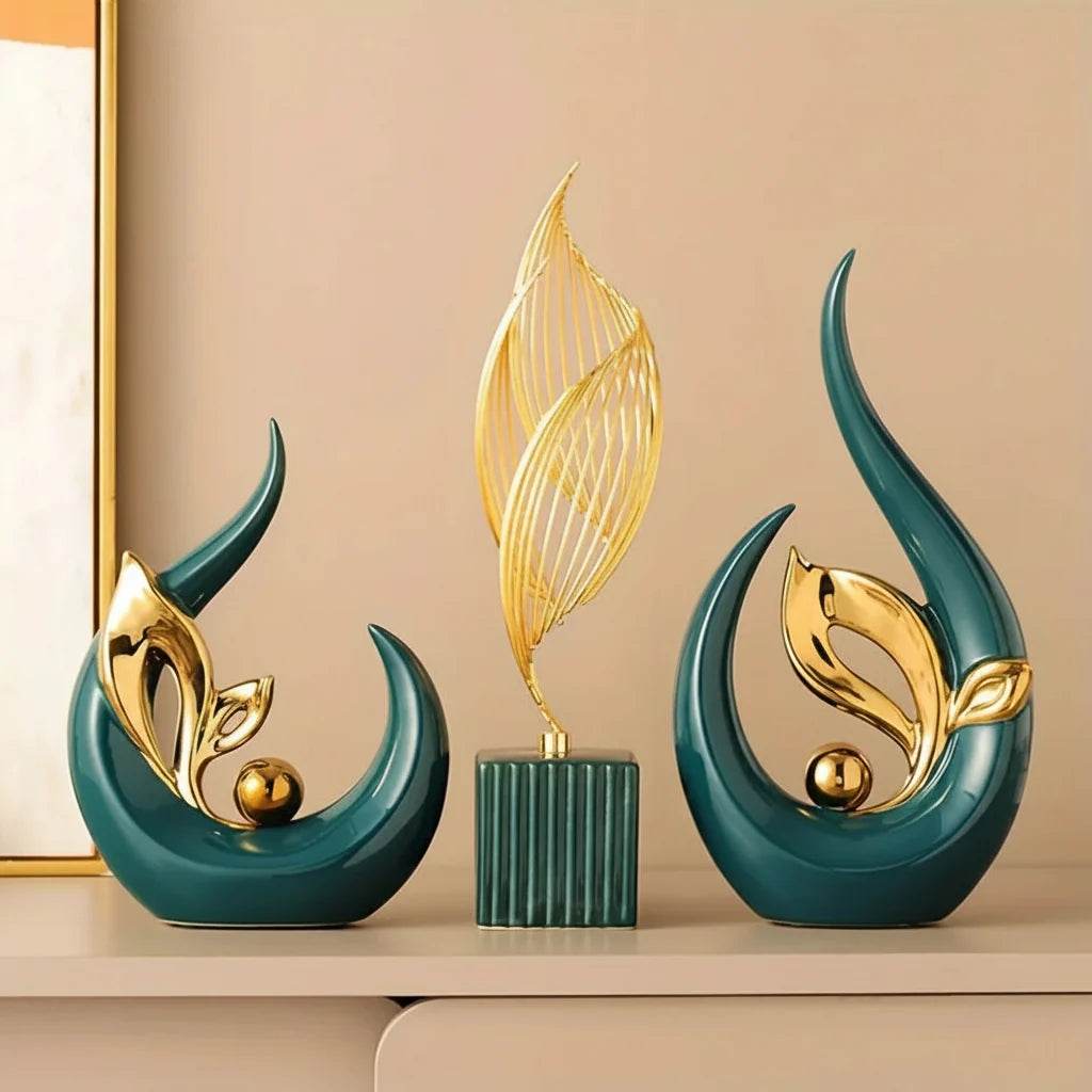 Nordic Ceramic Statue set featuring glossy teal sculptural forms, gold leaf-like metal accents and a slender golden wire feather atop a ribbed base.