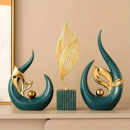 Nordic Ceramic Statue set featuring glossy teal sculptural forms, gold leaf-like metal accents and a slender golden wire feather atop a ribbed base.