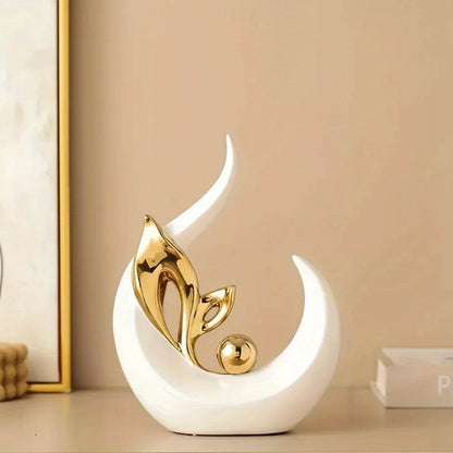 Nordic Ceramic Statue with a glossy white crescent-shaped base, gold metallic leaf accents, and a small gold orb.