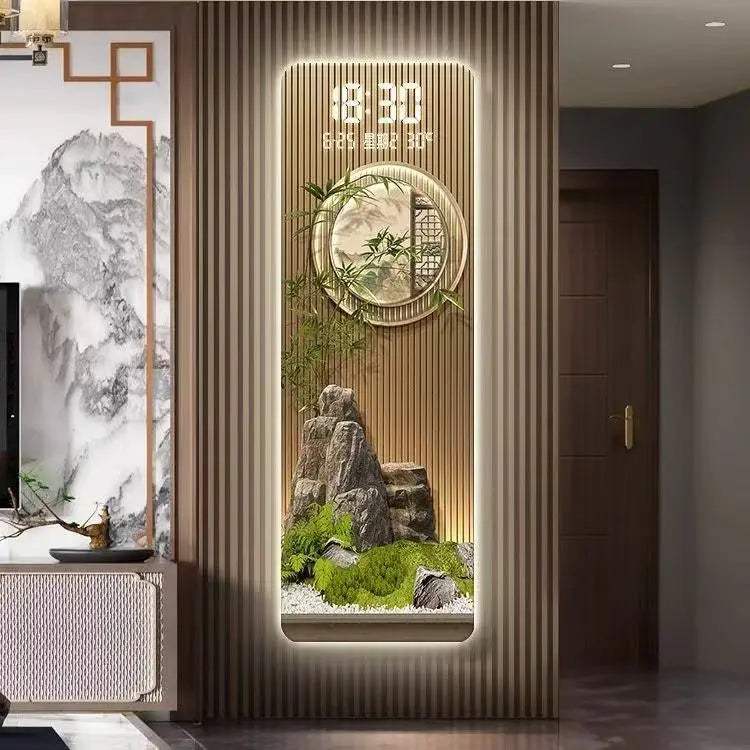 Perpetual Calendar Pendant Clock wall light with a gold-toned slatted panel, illuminated digital display, round clock and miniature landscape feature.