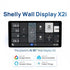 Smart home touchscreen control panel, Shelly Wall Display X2I, with a black rectangular screen showing tiled controls.