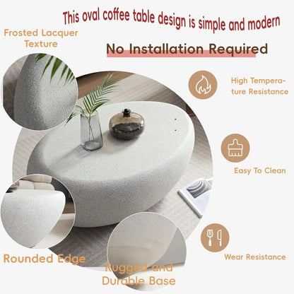 Oval Stone Coffee Table Fiberglass Frame with white speckled faux-stone surface, rounded edges and a rugged base
